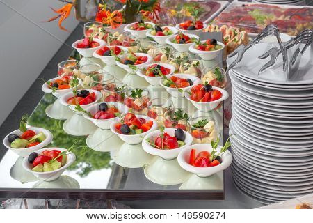 Banquet Table in restaurant served with different meals. Ready for wedding reception.