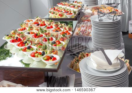 Banquet Table in restaurant served with different meals. Ready for wedding reception.