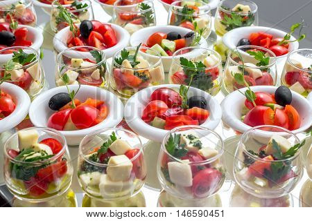 Banquet Table in restaurant served with different meals. Ready for wedding reception.