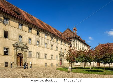 Einsiedeln, Switzerland - 8 September, 2015: people in the courtyard of the Einsiedeln Abbey. Einsiedeln Abbey is a Benedictine monastery in the town of Einsiedeln in the Swiss Canton of Schwyz.