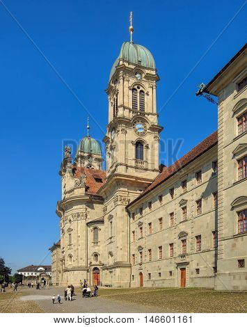 Einsiedeln, Switzerland - 8 September, 2015: people at the entrance to the Einsiedeln Abbey. Einsiedeln Abbey is a Benedictine monastery in the town of Einsiedeln in the Swiss Canton of Schwyz.