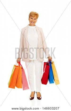 Happy business woman holging shopping bags