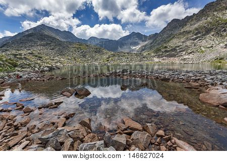Clouds over Musala peak and reflection in Musalenski lakes,  Rila mountain, Bulgaria