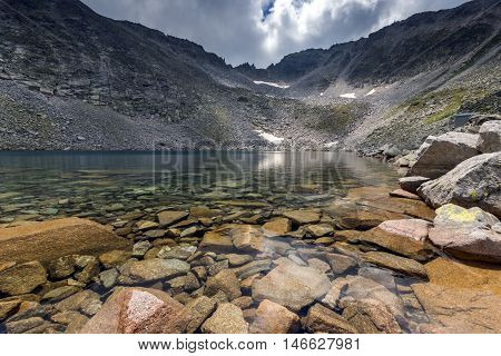 Ledenoto (Ice) Lake and clouds over Musala Peak, Rila mountain, Bulgaria
