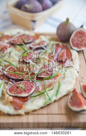 freshly baked French Flammkuchen with figs and cheese