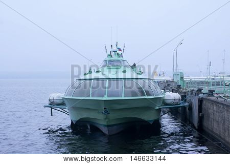 Passenger Hydrofoil Boat On The Docks Of Onego Lake In Foggy Weather, Petrozavodsk, Karelia, Russia.