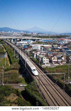 Shizuoka - OCT 08: Shinkansen bullet train and Mountain Fuji on OCT 08 ,2015 , Shizuoka ,Japan. Shinkansen is world's busiest high-speed railway operated by four Japan Railways companies.
