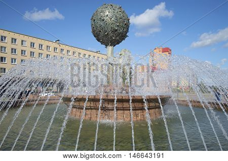 LOMONOSOV, RUSSIA - SEPTEMBER 20, 2015: Orange tree in the water jets. The fountain in the town of Lomonosov. Tourist landmark