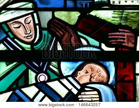 Poissy France - august 6 2016 : stained glass window of the historical collegiate church where the king Saint Louis was baptised