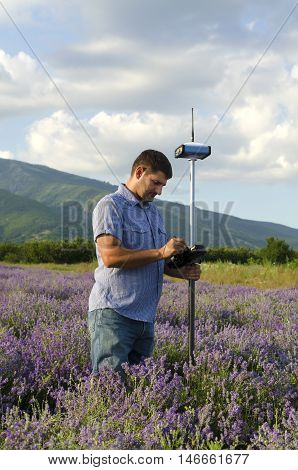 Land surveyor working in the lavender field
