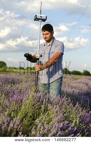 Land surveying in a lavender field during the day
