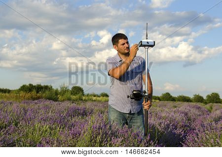 Horizontal shot of land surveying work in lavender