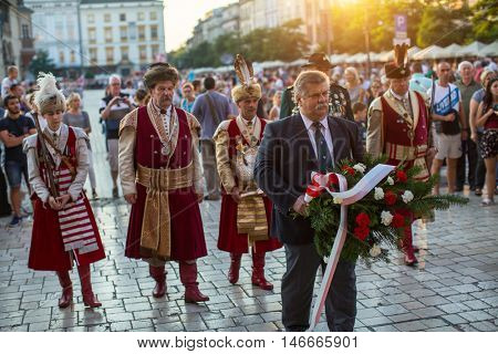 KRAKOW, POLAND - FEB 10, 2016: Unidentified participants of ceremony is the vow of first classes of the Jan III Sobieski High School (founded in 1883) at the Main Market Square near St.Mary Cathedral.