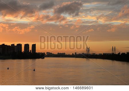Cable stayed bridge and Neva river on the outskirts of St. Petersburg at sunset Russia.