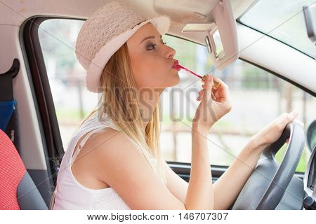Woman Applying Makeup While Driving Her Car