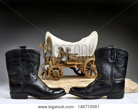 Kids cowboy black boots and chuck wagon with room for your type.