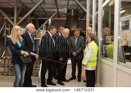 ST. PETERSBURG, RUSSIA - AUGUST 11, 2016: Vice-governor of St. Petersburg Igor Divinsky (center) during his working visit to the Heineken brewery. Brewery can produce 5 millions HL of beer per year