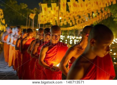 Chiang Mai, Thailand - May 20: Thai Buddhist Monks Meditate With .candle Lighting During The Religio