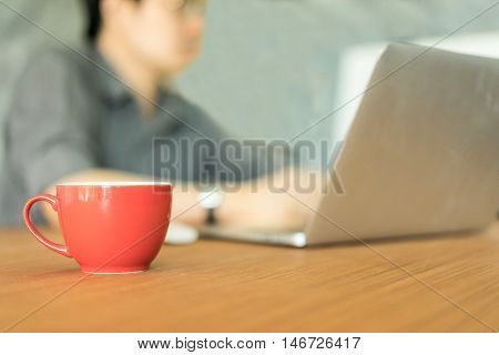 businessman working with laptop computer in office Business concept soft focus vintage tone