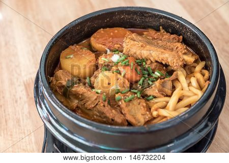 Gamjatang Korean Spicy Pork rib Soup with Kimchi and udon