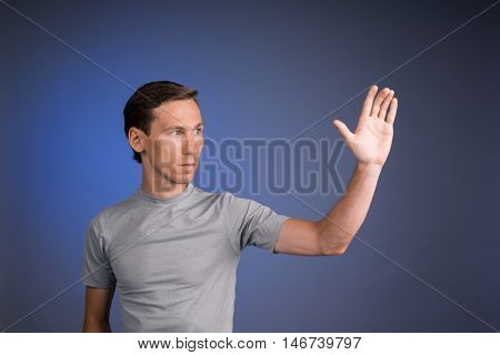 Man working with virtual touch screen.