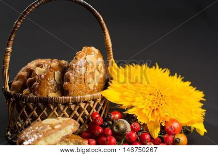 Typical Dutch filled spicy cookies with almonds on autumn colored and dark background