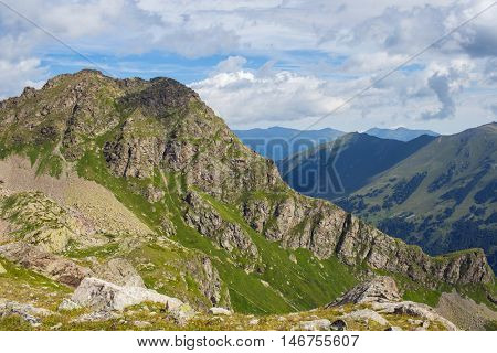 mountain under sky with dramatic clouds