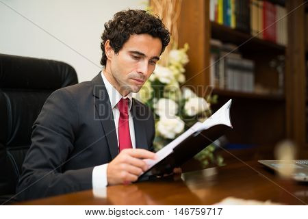 Businessman reading his agenda