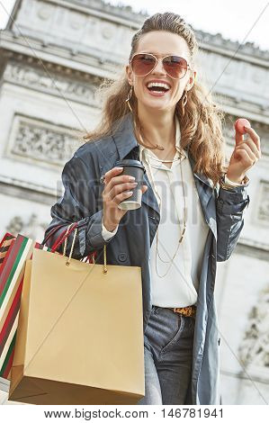 Woman With Shopping Bags In Paris Having Coffee And Macaroon