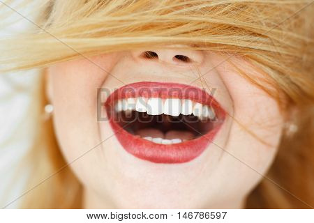 Happy laughing woman with red hair close-up. portrait of unrecognizable carroty girl with wide perfect smile. Fun, gladness, joy concept