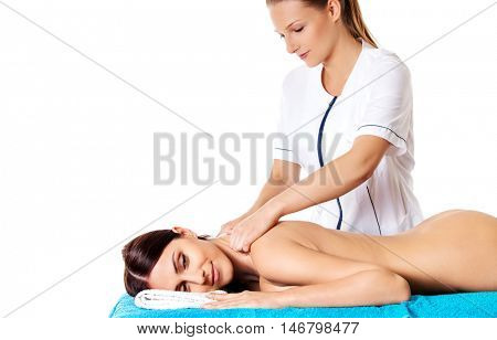 Woman having massage of body in the spa salon. Beauty treatment concept.