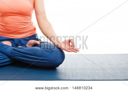 Close up of of woman in yoga asana Padmasana (Lotus pose) cross legged position for meditation with Chin Mudra - psychic gesture of consciousness isolated on white background with copyspace