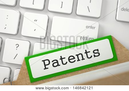 Patents written on Green Card Index on Background of Modern Keyboard. Closeup View. Selective Focus. 3D Rendering.