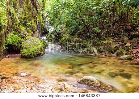 Beautiful waterfall and small river from mountain in rain forest. Umpang Thailand.