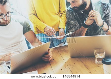 Business Startup People Brainstorming Process.Coworkers Making Great Decisions.Young Bearded Hipsters Team Discussion Corporate Work Concepts.Creative Manager Analyze Project Wood Table Modern Office