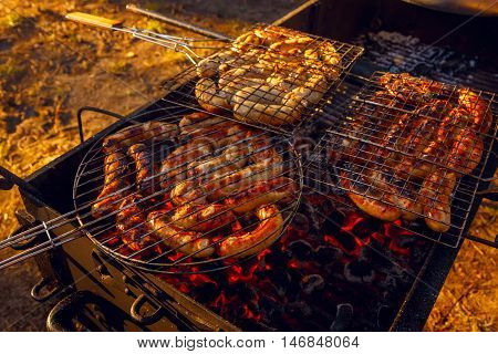 Barbeque grill sousage cooking on open air