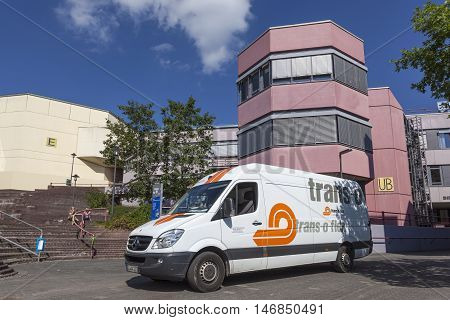 SIEGEN GERMANY - SEP 8 2016: Trans-o-flex delivery van at the university of Siegen campus. North Rhine Westphalia Germany