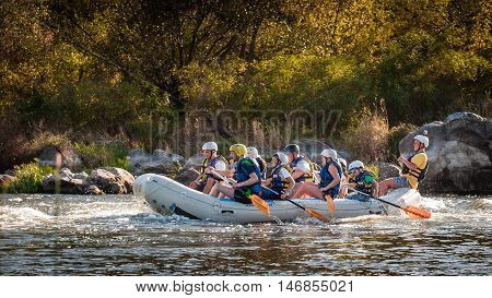 Village Mygiya, Nikolaev region, Ukraine - September 10, 2016: Rafting on the Southern Bug River. An experienced instructor holds the key to a great adventure. Rafting in Ukraine. Risky, bold action.