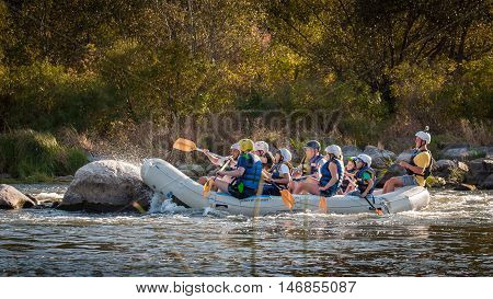 Village Mygiya, Nikolaev region, Ukraine - September 10, 2016: Rafting on the Southern Bug River. An experienced instructor holds the key to a great adventure. Rafting in Ukraine. Risky, bold action.