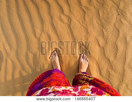 Feet in the desert. View from above