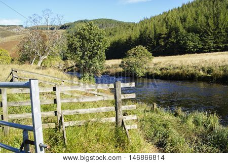 River Shee with fenced and tree festered banks