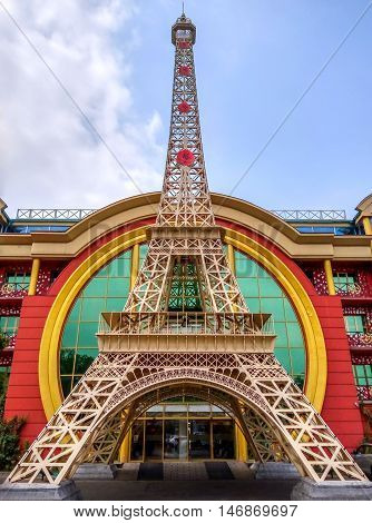 ALMATY KAZAKHSTAN - SEPTEMBER 12 2016: Reduced copy of Eiffel Tower on the street Furmanova. Almaty is the largest city in Kazakhstan and was the country's capital until 1997.