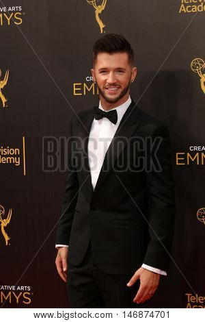 LOS ANGELES - SEP 11:  Travis Wall at the 2016 Primetime Creative Emmy Awards - Day 2 - Arrivals at the Microsoft Theater on September 11, 2016 in Los Angeles, CA