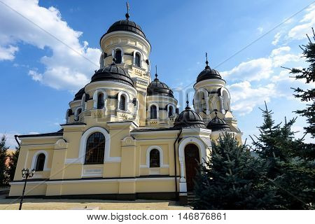 Photo of Capriana Monastery in Moldova with blue sky