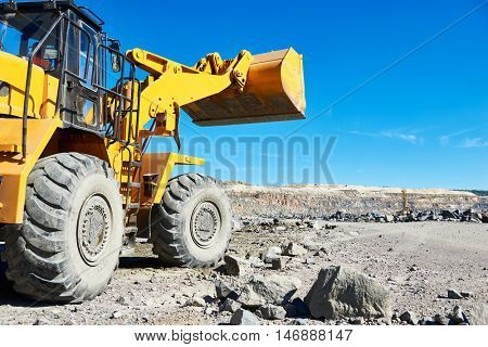 wheel loader excavator at granite or iron ore opencast mine