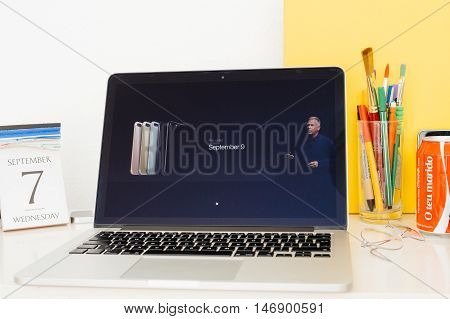 PARIS FRANCE - SEP 8 2016: Apple Computers website on MacBook Retina in room environment showcasing live coverage of Apple Keynote - iPhone preorder delivery and order dates
