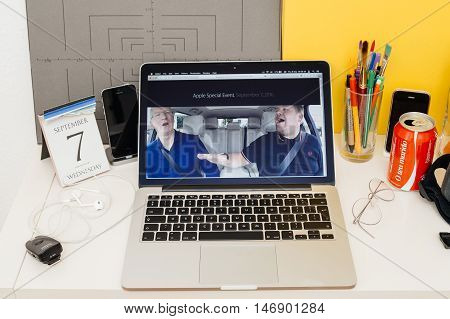 PARIS FRANCE - SEP 8 2016: Apple Computers website on MacBook Retina in room environment showcasing live coverage of Apple Keynote - CEO Tim Cook singing with James Corden in a Carpool Karaoke type video