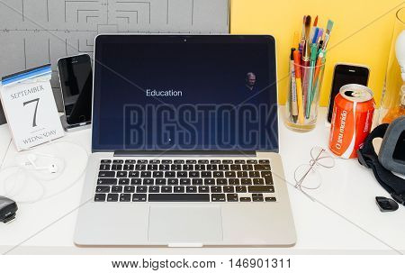 PARIS FRANCE - SEP 8 2016: Apple Computers website on MacBook Retina in room environment showcasing live coverage of Apple Keynote - Tim Cook about Education programm