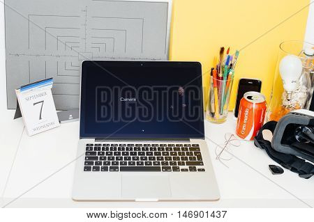 PARIS FRANCE - SEP 8 2016: Apple Computers website on MacBook Retina in room environment showcasing live coverage of Apple Keynote - presentation of iPhone new photo camera double camera