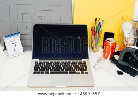 PARIS FRANCE - SEP 8 2016: Apple Computers website on MacBook Retina in room environment showcasing live coverage of Apple Keynote - presentation of iPhone new photo camera double camera